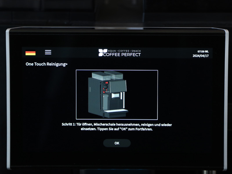 Displayanweisung: Tuer oeffnen, Mischerschale herausnehmen, reinigen und wieder einsetzen.